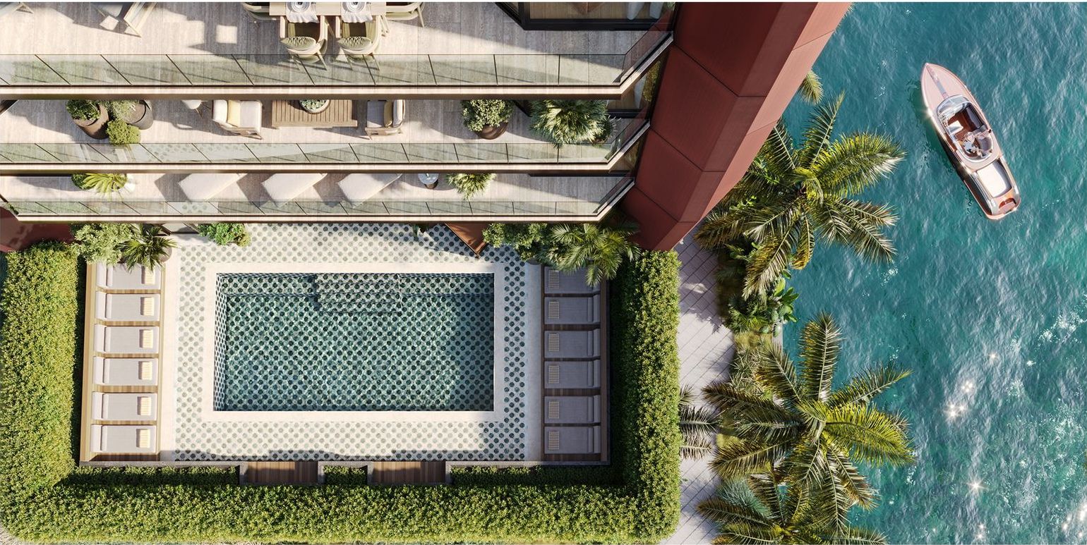 Villa Miami, the Level 5 pool from above, with the bay and a boat at the dock, developer rendering